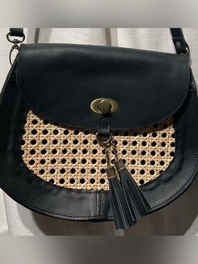 Black leather and rattan purse made in Indonesia